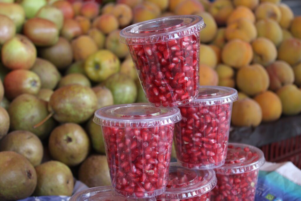 pomegranate in plastic cups